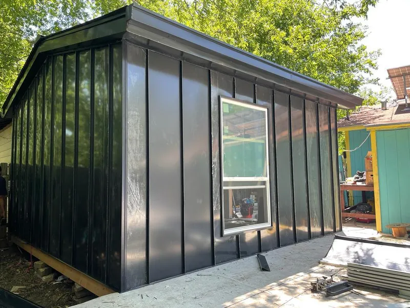 Black standing seam metal wall panels for Roof Inspection in Orting